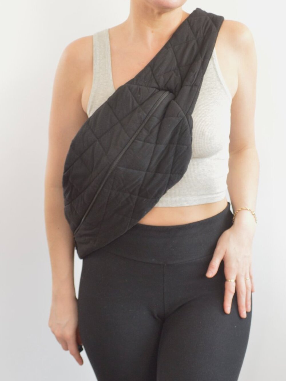 skin worldwide organic cotton quilted sling bag in black